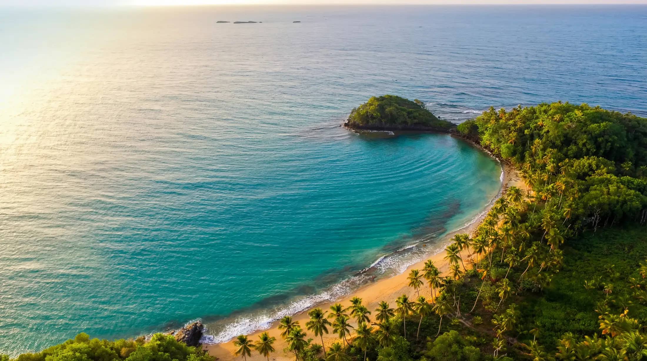 Playa Escondida in Las Terrenas, a secluded bay with turquoise water and dramatic green coastline
