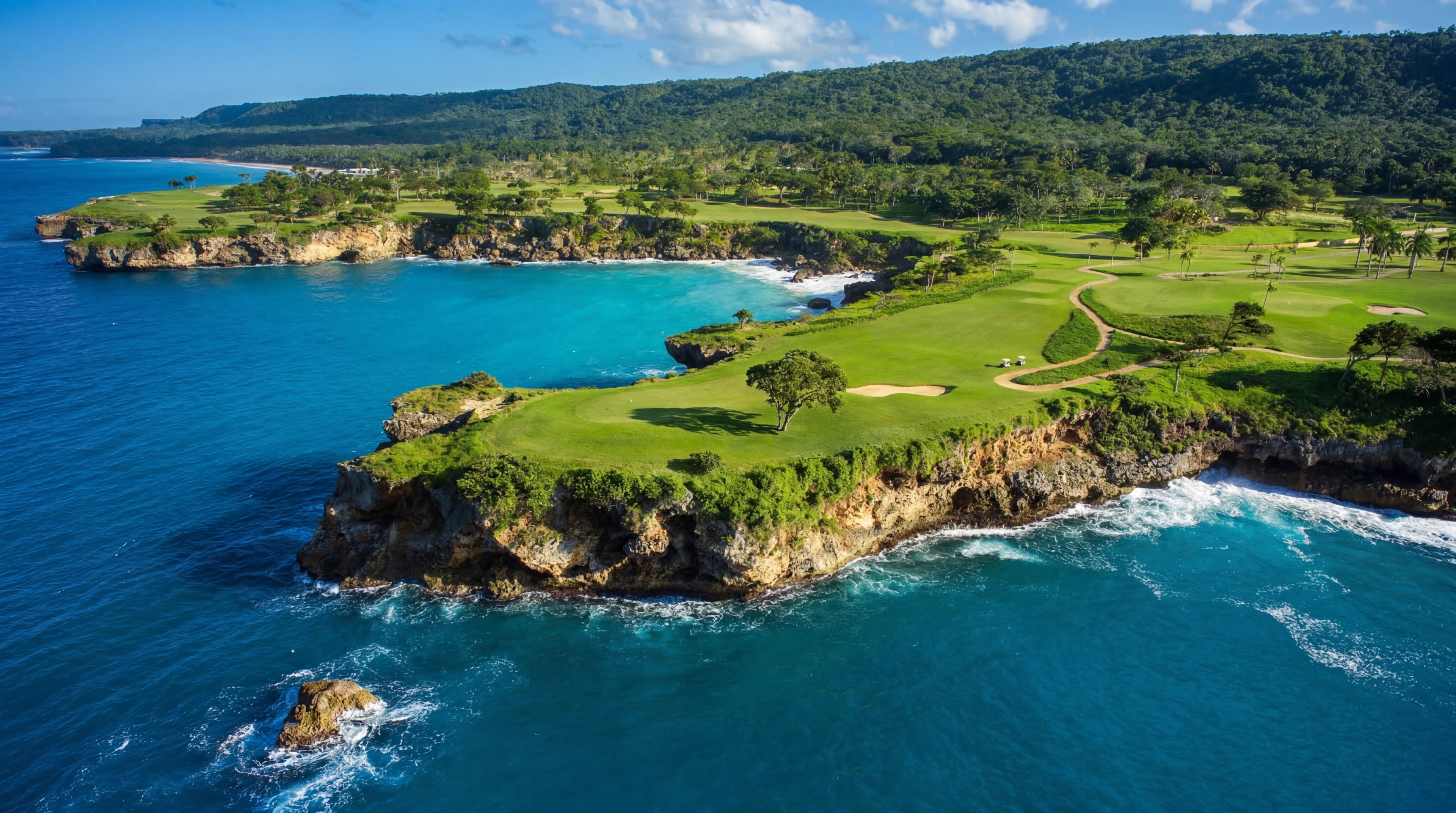Rio San Juan coastal landscape with cliffside greens and vivid blue water